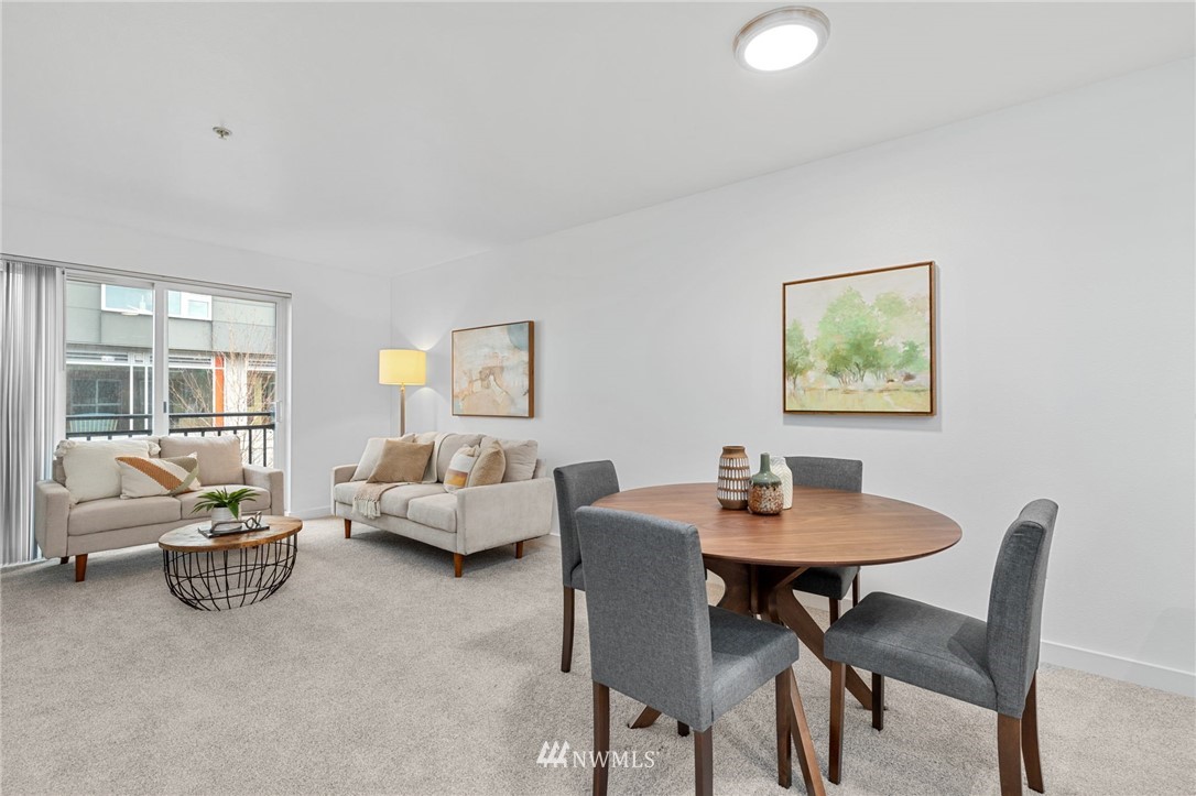 108 5th Avenue South, Unit 710 Seattle, WA 98104 - Photo 5 of 22 a dining room with furniture and window