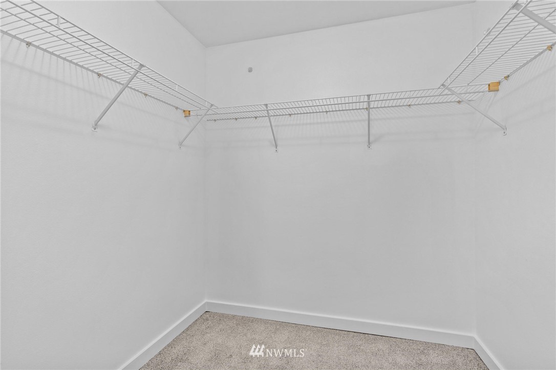 108 5th Avenue South, Unit 710 Seattle, WA 98104 - Photo 10 of 22 a view of a room with racks on the wall