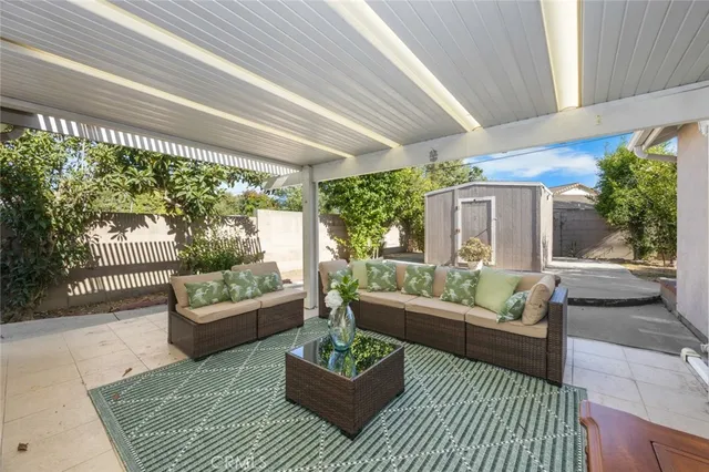 a outdoor living space with furniture and a potted plant