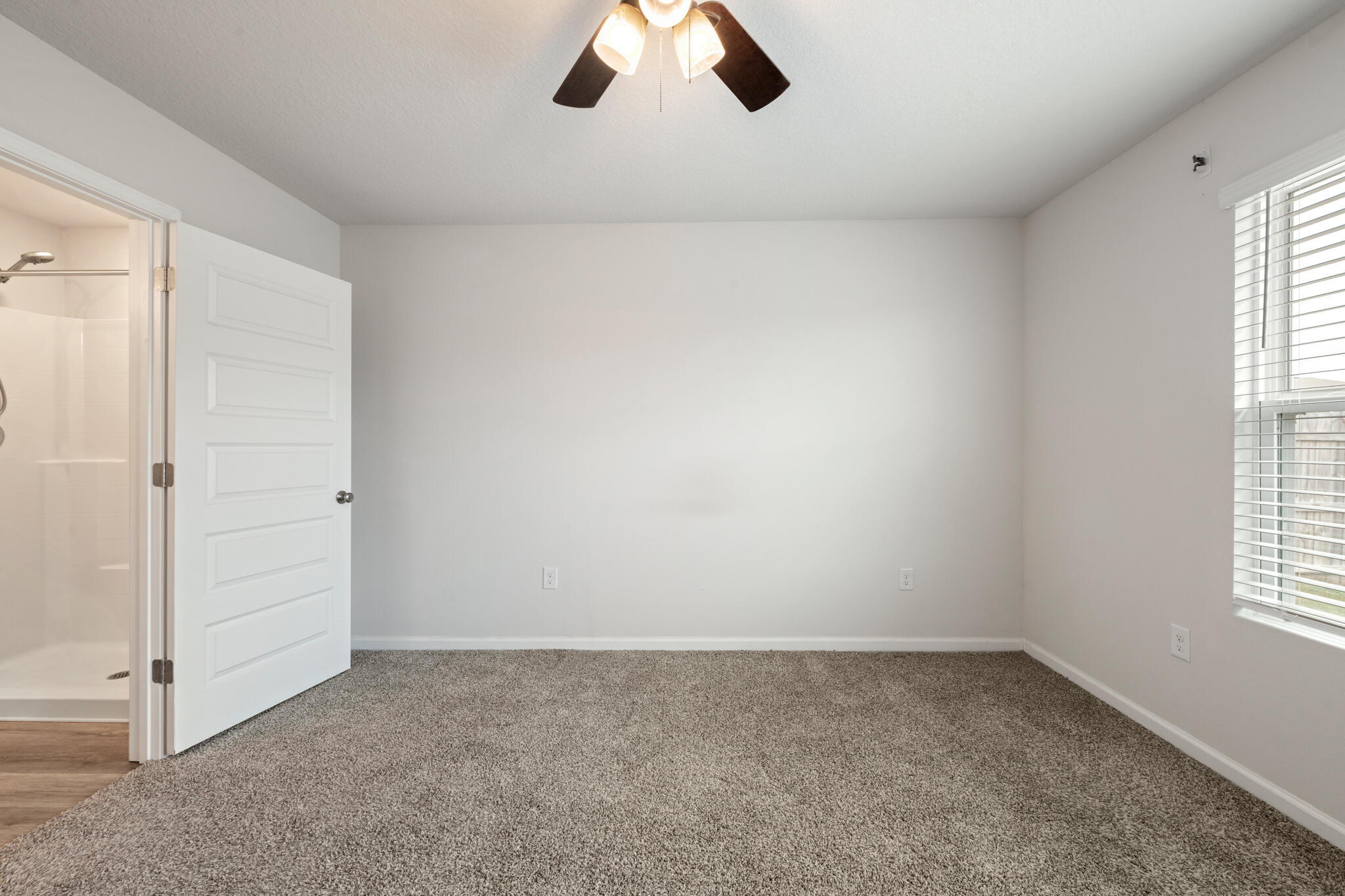 932 Sandbar Loop Crestview, FL 32539 - Photo 18 of 44 an empty room with chandelier fan and windows