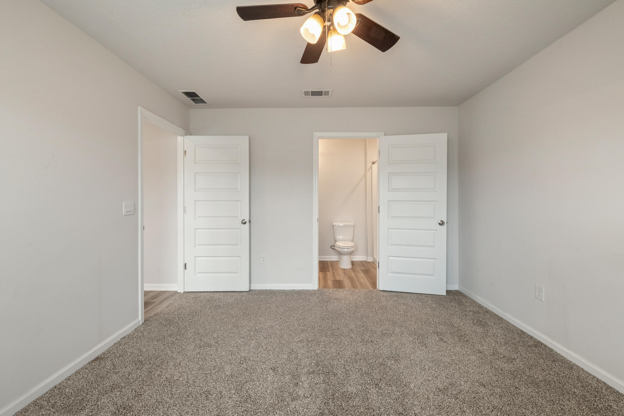 932 Sandbar Loop Crestview, FL 32539 - Photo 20 of 44 a view of an empty room and chandelier fan