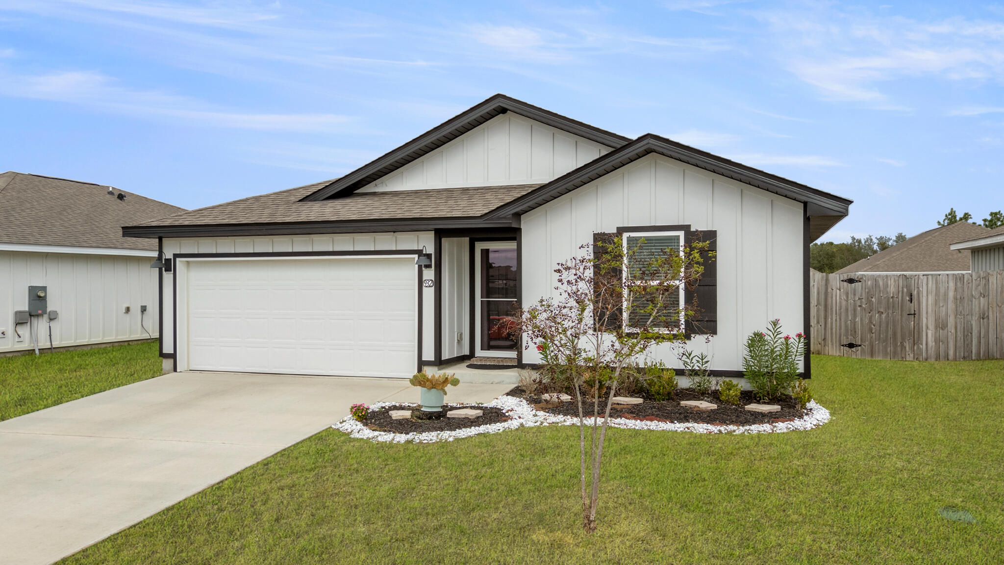 932 Sandbar Loop Crestview, FL 32539 - Photo 2 of 44 a front view of house with yard and garage