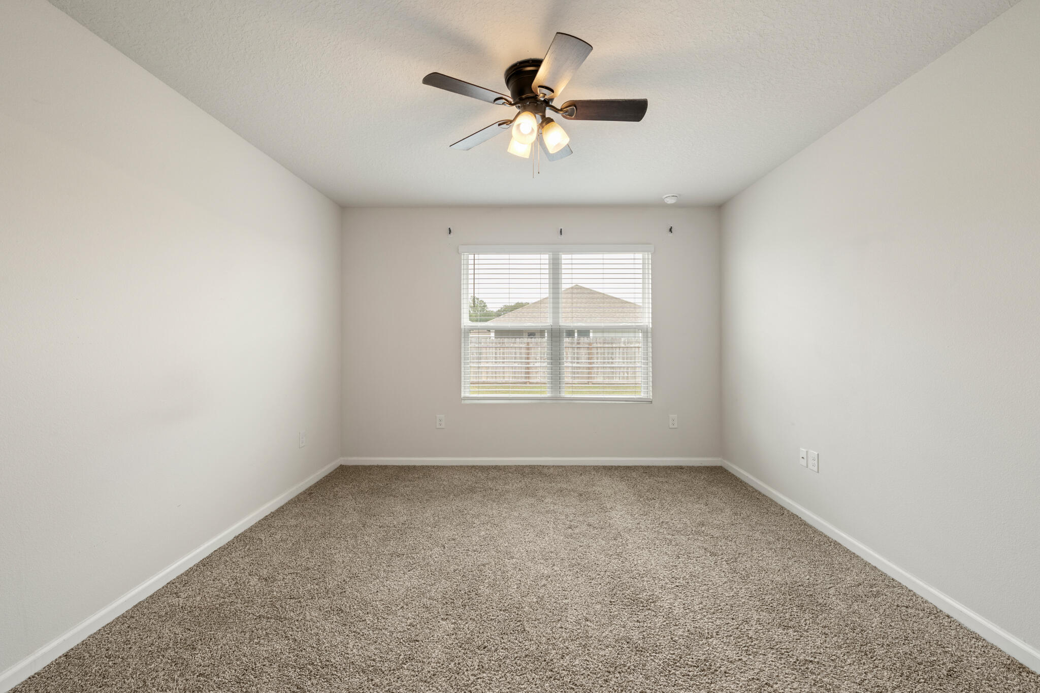 932 Sandbar Loop Crestview, FL 32539 - Photo 21 of 44 an empty room with a window and a ceiling fan