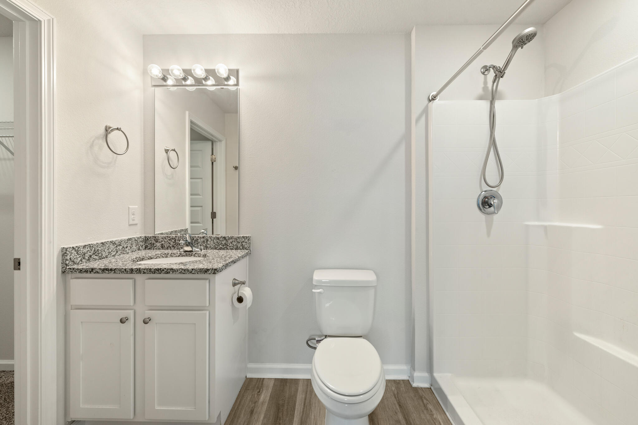 932 Sandbar Loop Crestview, FL 32539 - Photo 22 of 44 a bathroom with a granite countertop sink toilet and shower