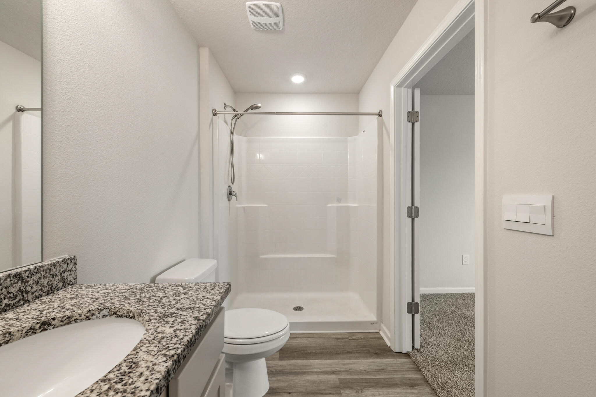 932 Sandbar Loop Crestview, FL 32539 - Photo 24 of 44 a bathroom with a granite countertop sink toilet and shower