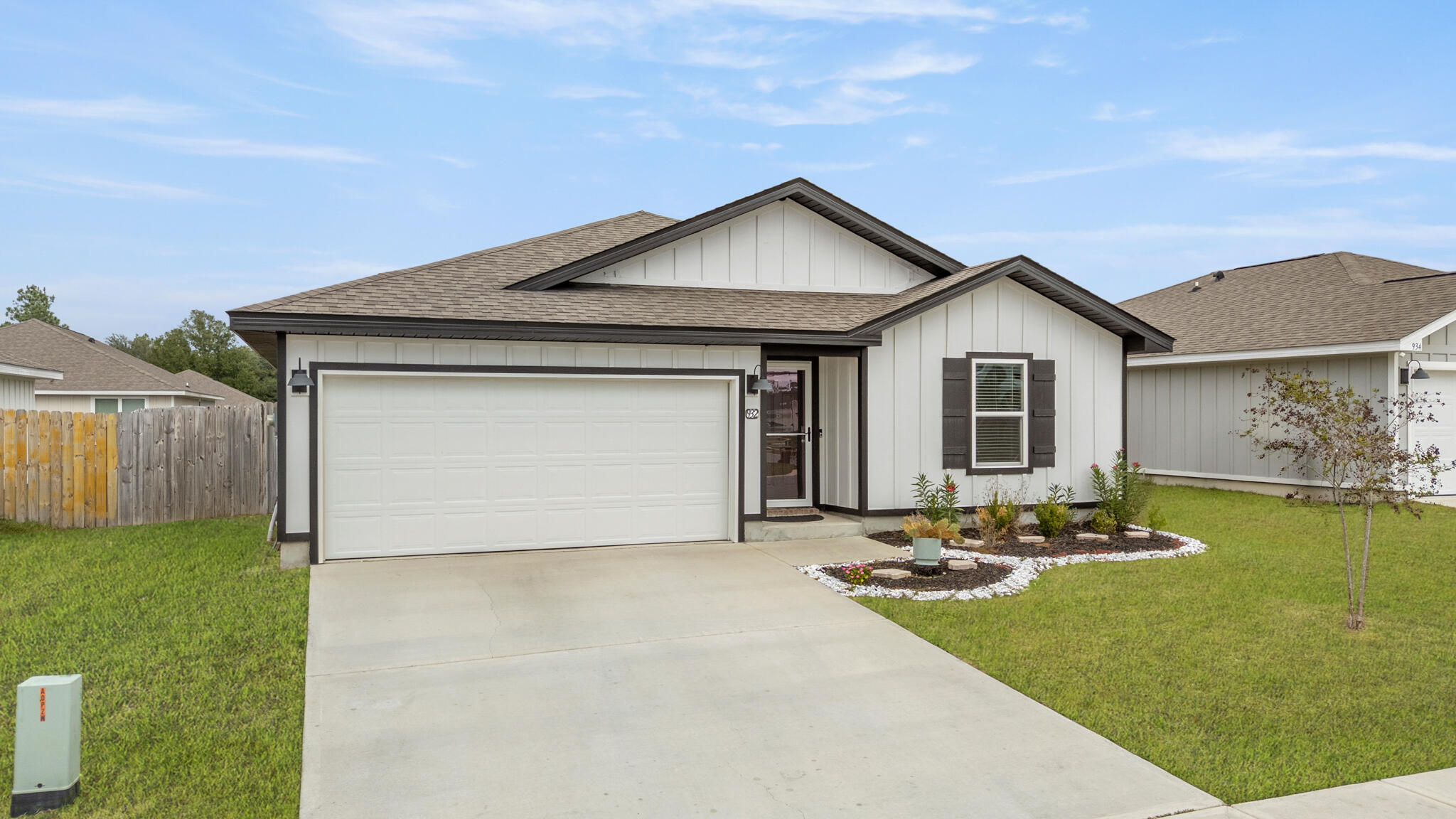 932 Sandbar Loop Crestview, FL 32539 - Photo 3 of 44 a front view of a house with a yard