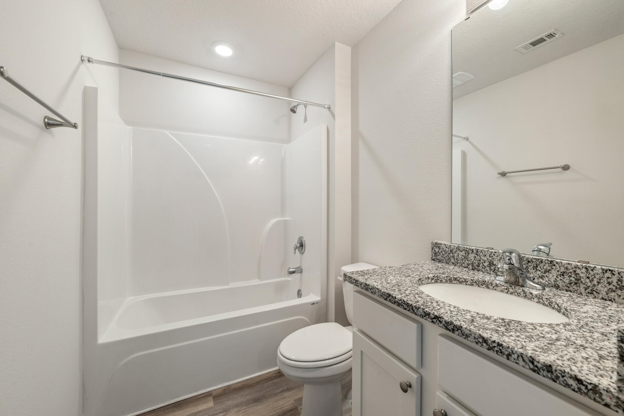 932 Sandbar Loop Crestview, FL 32539 - Photo 31 of 44 a bathroom with a granite countertop sink toilet and shower