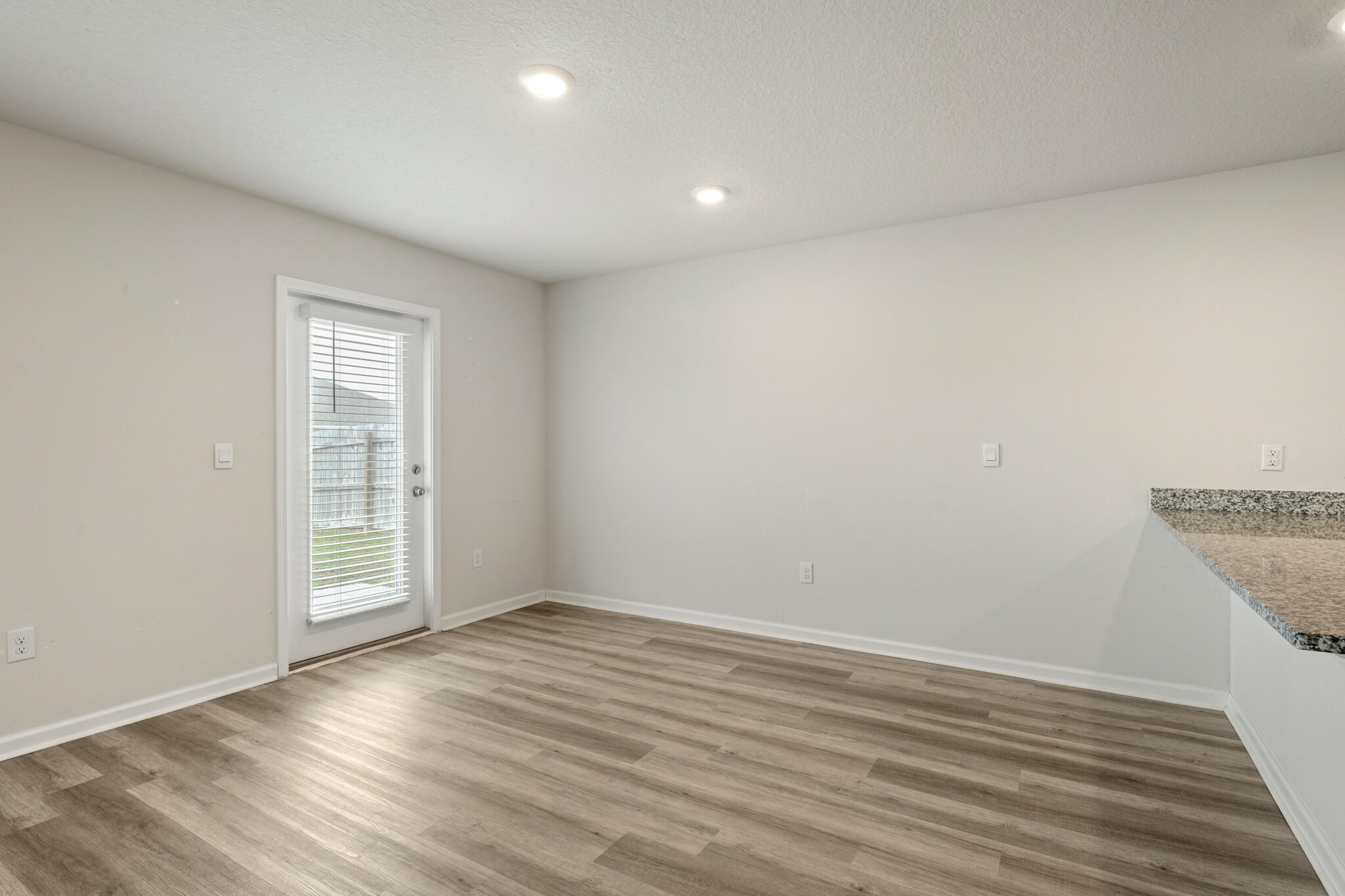 932 Sandbar Loop Crestview, FL 32539 - Photo 32 of 44 wooden floor in an empty room with a window