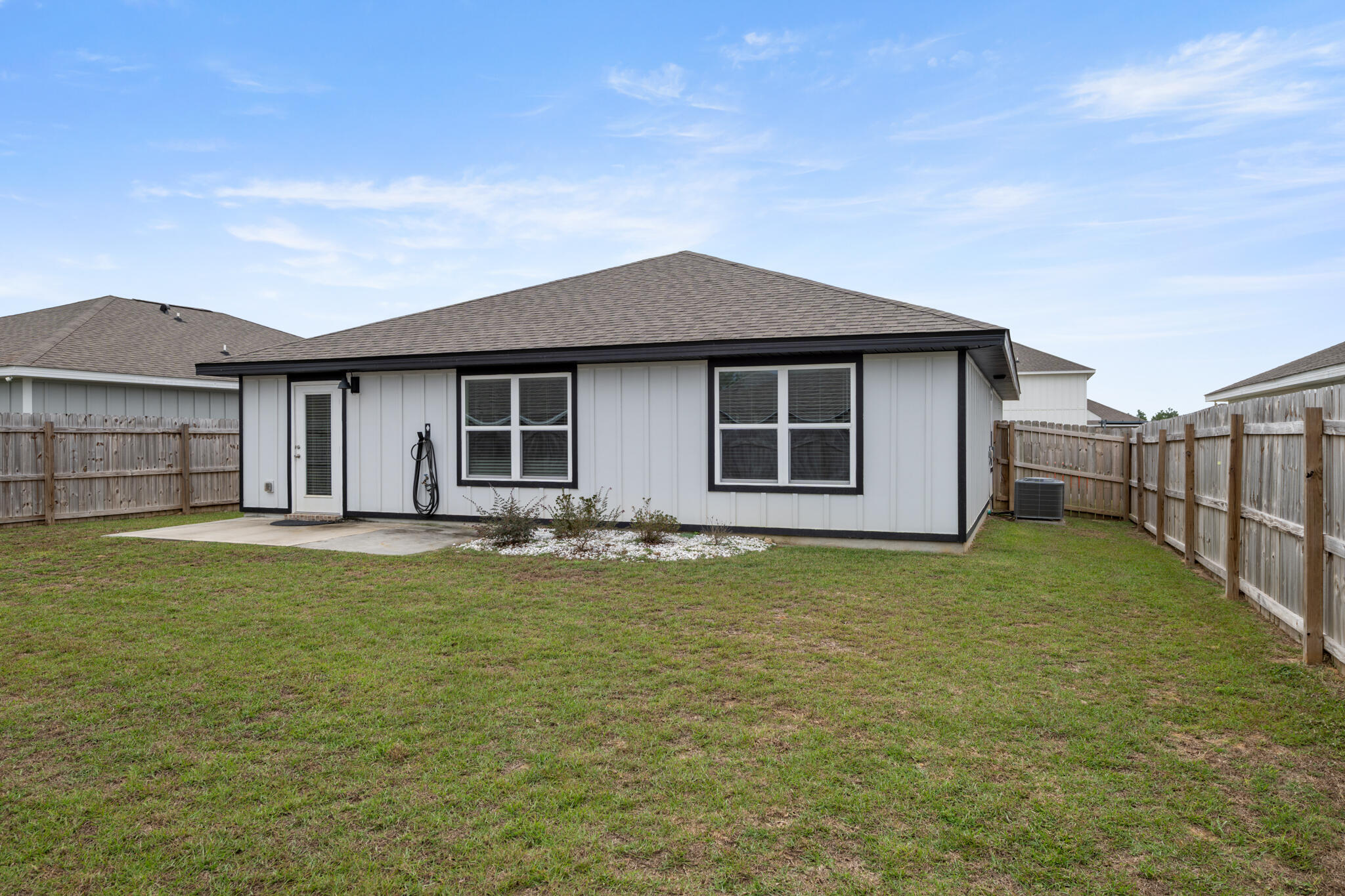 932 Sandbar Loop Crestview, FL 32539 - Photo 34 of 44 a backyard of a house with lots of green space