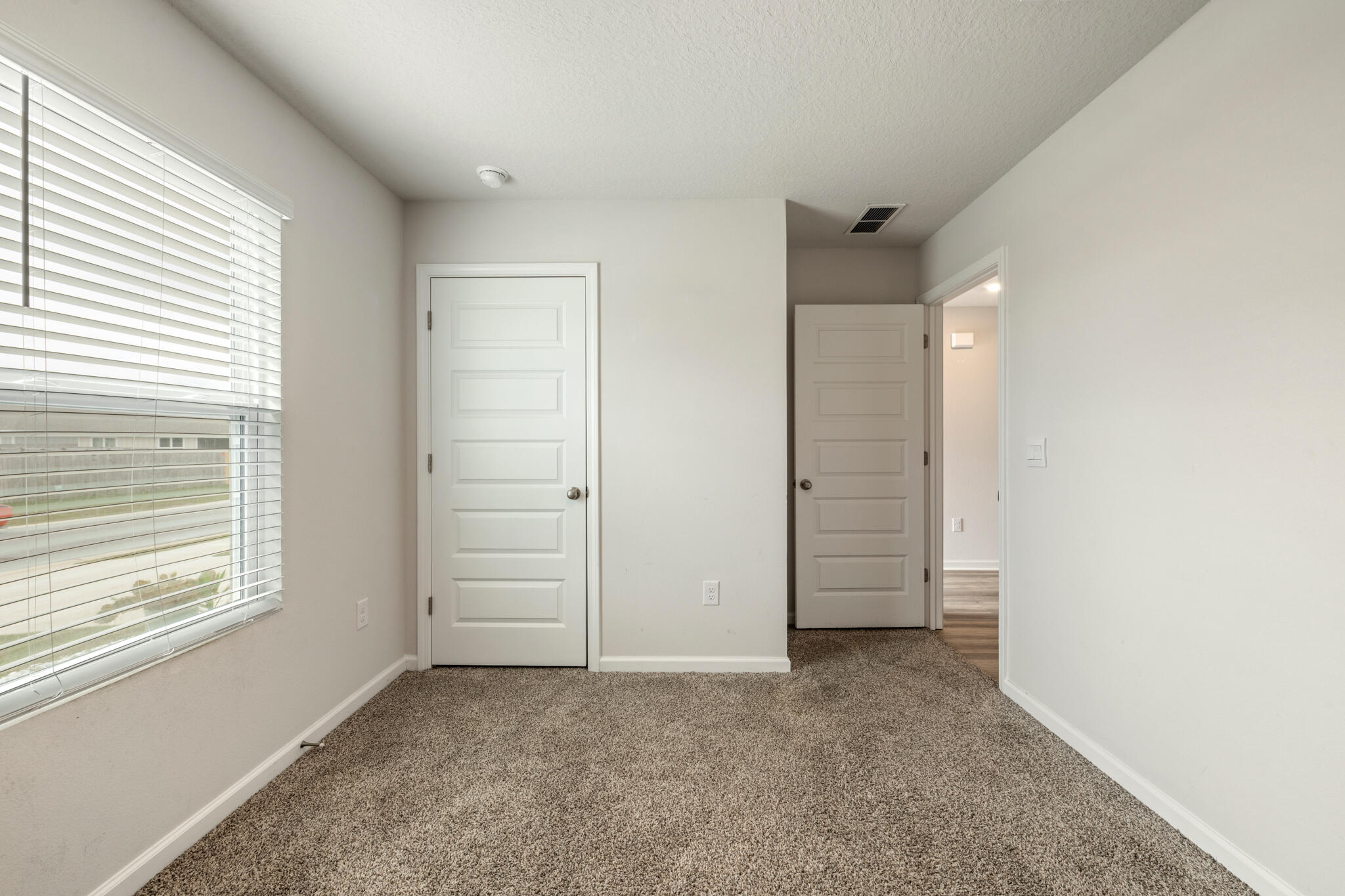 932 Sandbar Loop Crestview, FL 32539 - Photo 6 of 44 an empty room with windows and closet