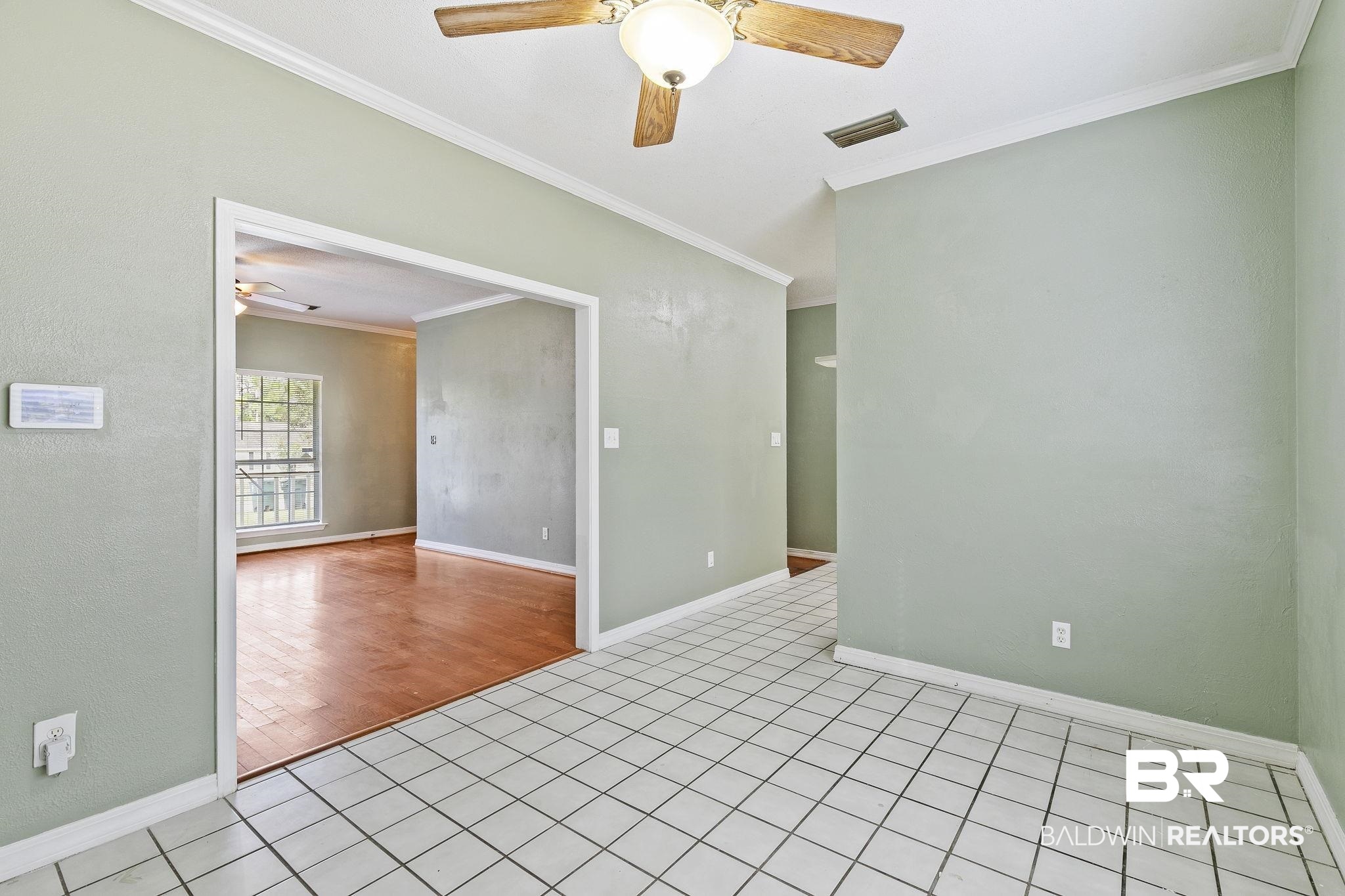 474 Ridgewood Drive Daphne, AL 36526 - Photo 19 of 57 Unfurnished room featuring crown molding, light wood-type flooring, and ceiling fan
