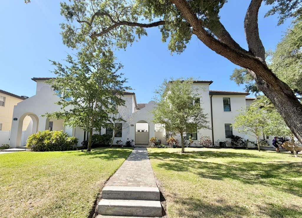 4606 West Fig Street, Unit 2 Tampa, FL 33609 - Photo 1 of 26 a front view of house with yard and green space