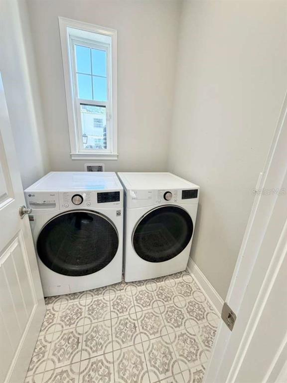 4606 West Fig Street, Unit 2 Tampa, FL 33609 - Photo 12 of 26 a utility room with dryer and washer