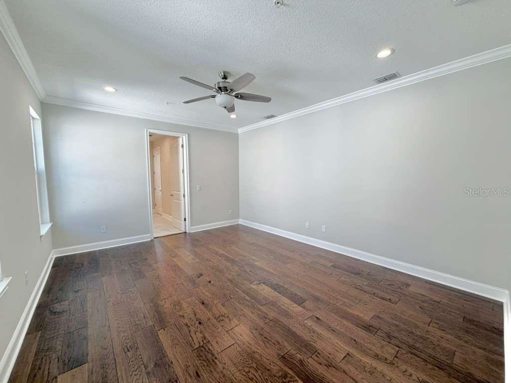 4606 West Fig Street, Unit 2 Tampa, FL 33609 - Photo 14 of 26 wooden floor in an empty room with a window