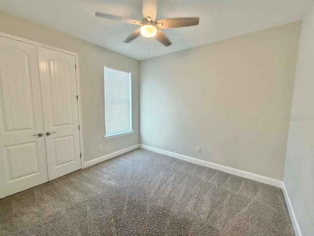 4606 West Fig Street, Unit 2 Tampa, FL 33609 - Photo 20 of 26 an empty room with closet and a ceiling fan