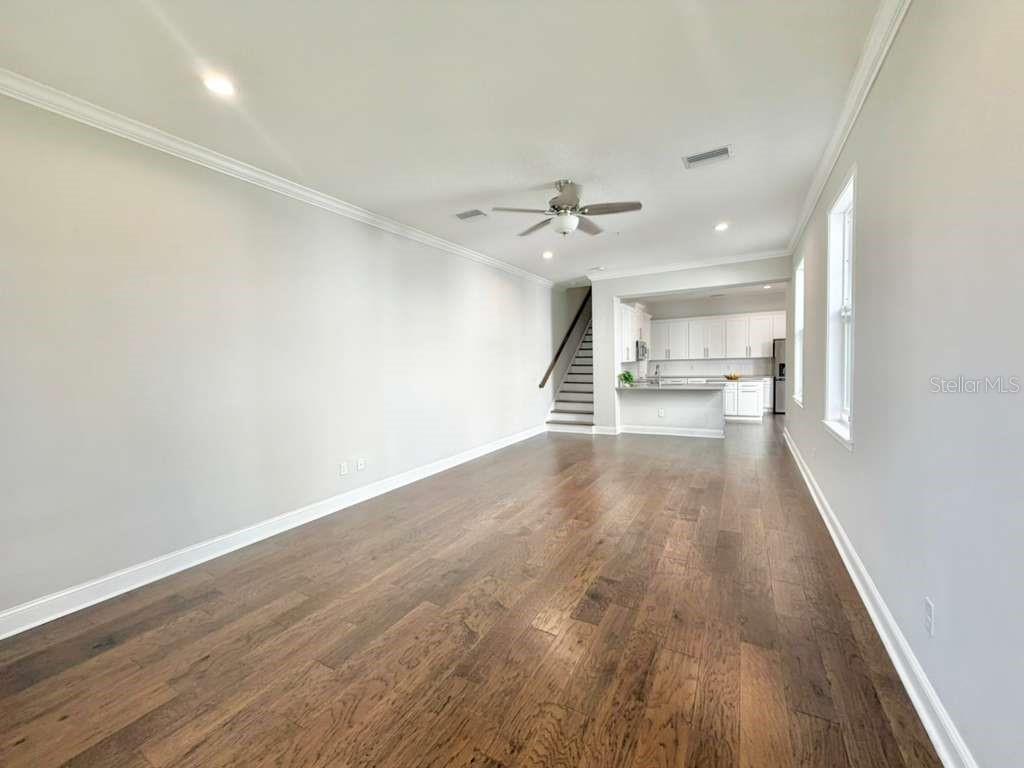4606 West Fig Street, Unit 2 Tampa, FL 33609 - Photo 2 of 26 wooden floor in an empty room with a window