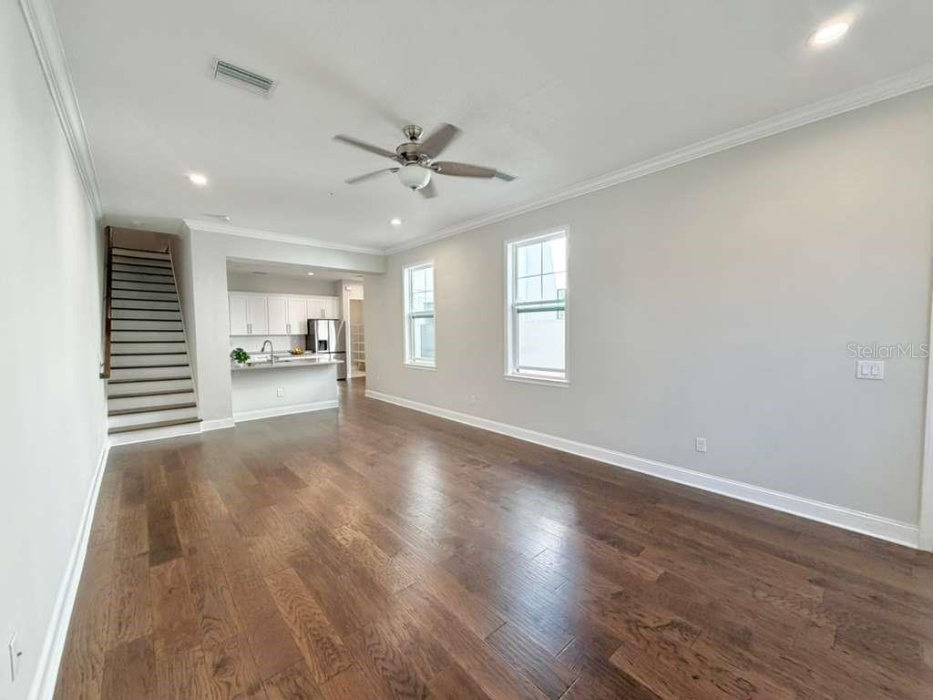 4606 West Fig Street, Unit 2 Tampa, FL 33609 - Photo 3 of 26 a view of empty room with wooden floor and window