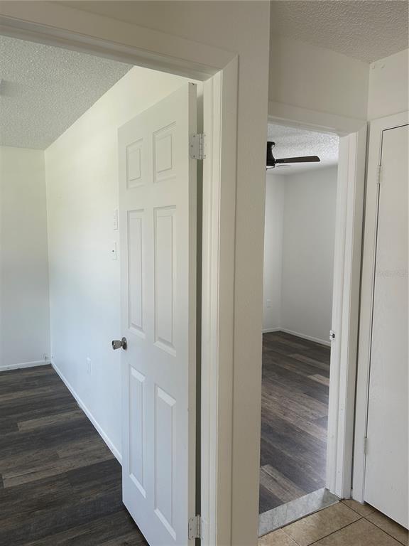 7808 Osteen Road New Port Richey, FL 34653 - Photo 10 of 20 a view of a hallway with wooden floor and staircase