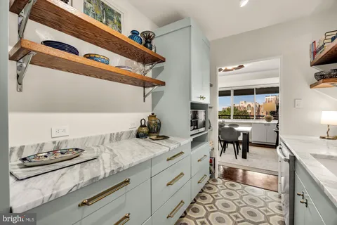a kitchen with a sink and a stove top oven