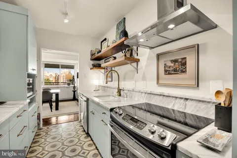 a kitchen with a stove and a sink