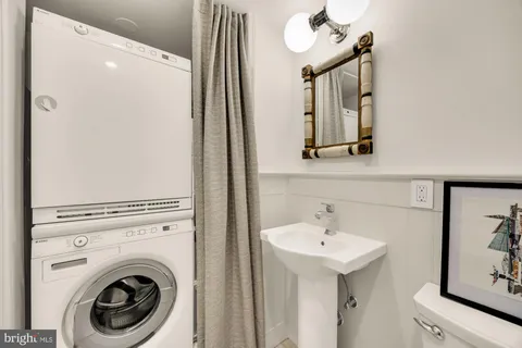 a view of a hallway with washer and dryer