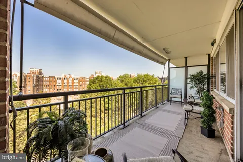 a view of balcony with furniture