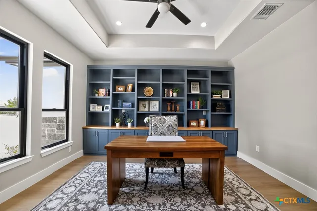 a workspace with furniture and window