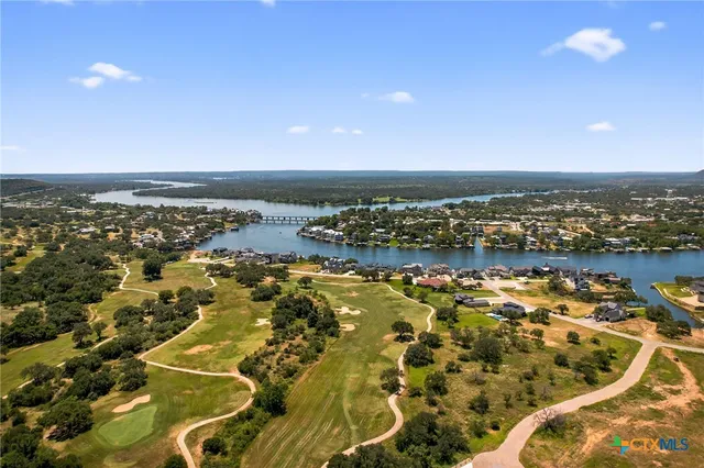 an aerial view of residential building and ocean view