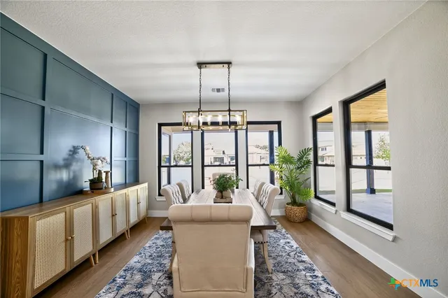 a living room with furniture fireplace and a potted plant