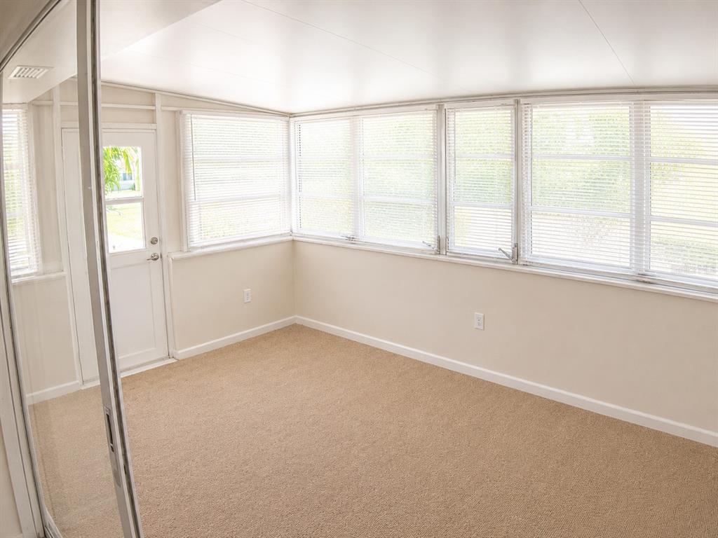 1559 Barry Road Clearwater, FL 33756 - Photo 8 of 20 an empty room with a window