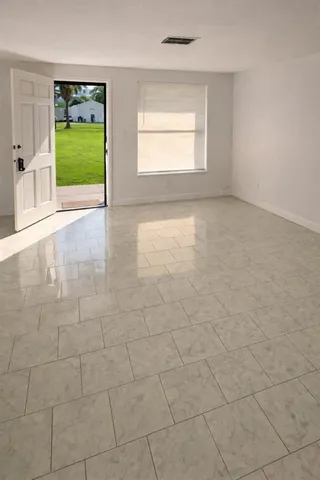 a view of an empty room with a window