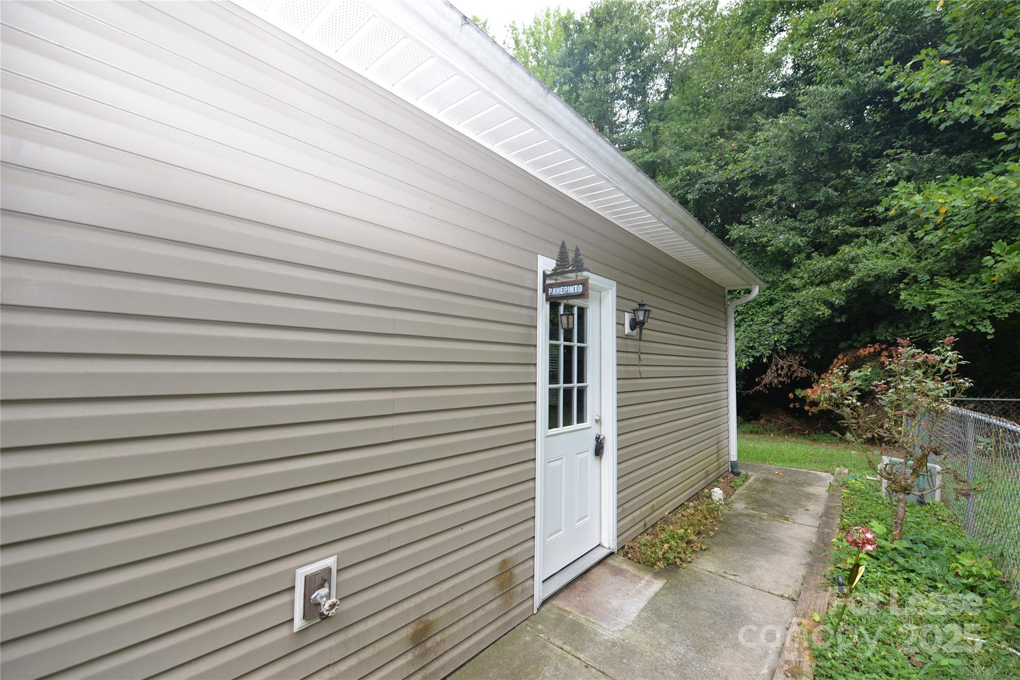 a view of a backyard with sitting area