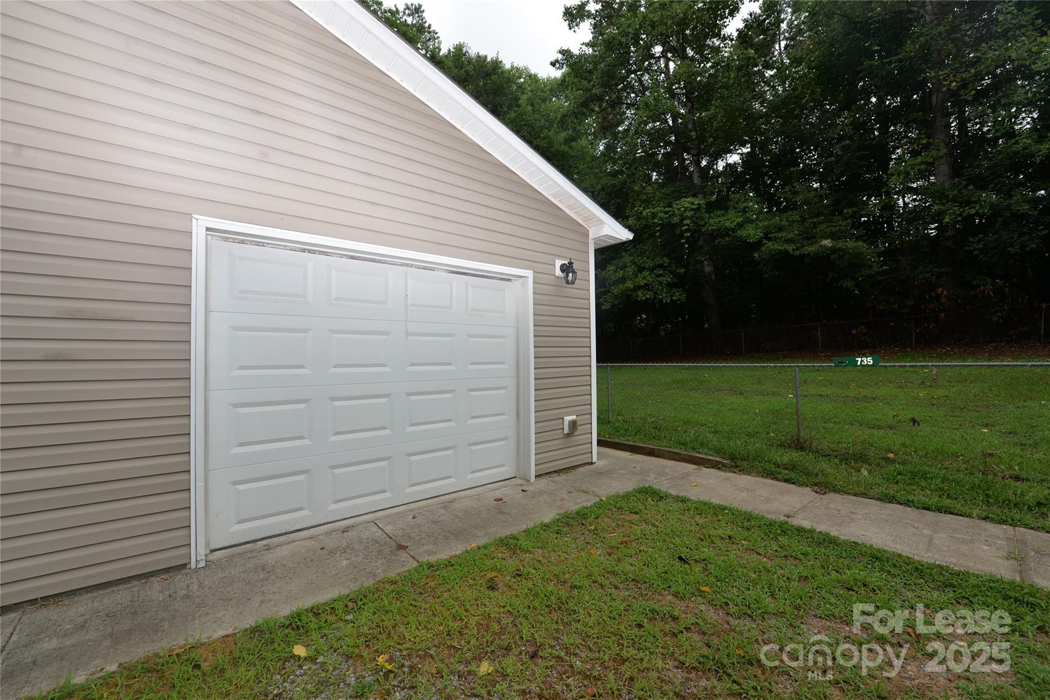 735 Seven Springs Way Denver, NC 28037 - Photo 11 of 11 a view of a backyard with a garden