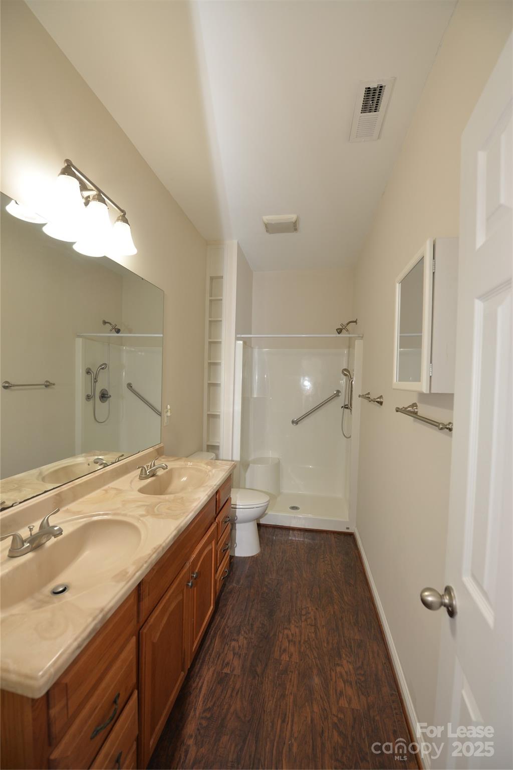 735 Seven Springs Way Denver, NC 28037 - Photo 3 of 11 a spacious bathroom with a sink a mirror and a shower