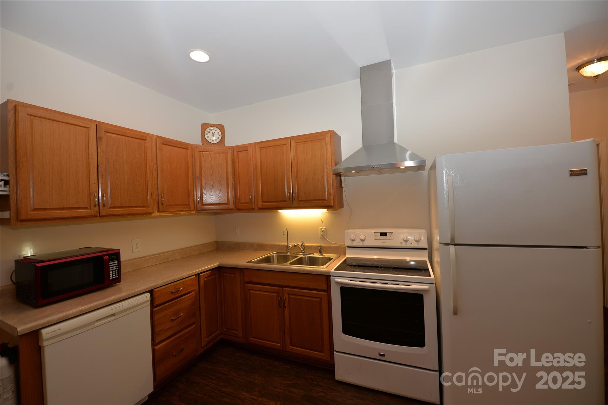 735 Seven Springs Way Denver, NC 28037 - Photo 7 of 11 a kitchen with stainless steel appliances a stove a microwave and a refrigerator