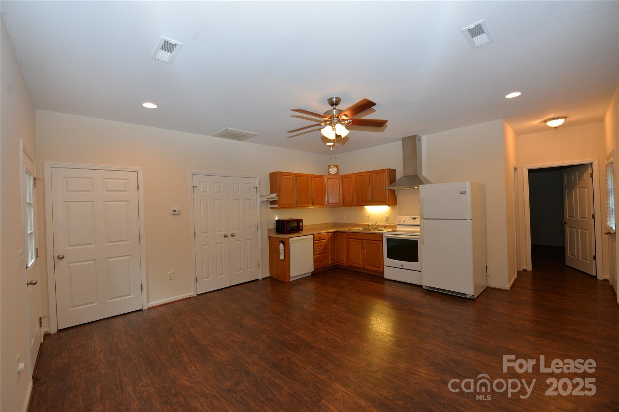 735 Seven Springs Way Denver, NC 28037 - Photo 9 of 11 a view of a kitchen with a sink a refrigerator and a stove
