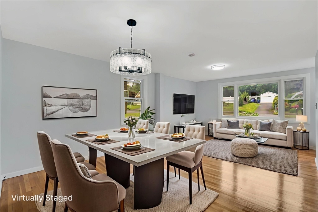 738 Piper Road West Springfield, MA 01089 - Photo 14 of 24 a view of a dining room with furniture wooden floor and chandelier
