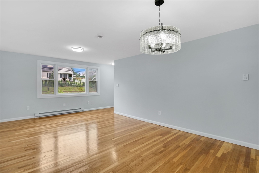 738 Piper Road West Springfield, MA 01089 - Photo 15 of 24 a view of an empty room with window and wooden floor