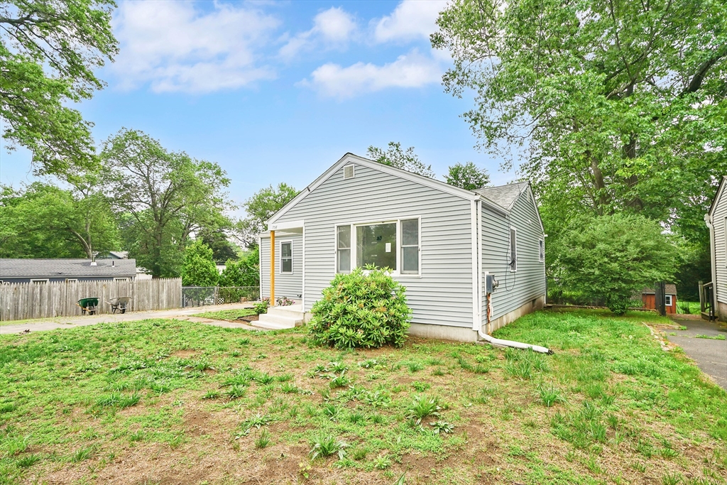 738 Piper Road West Springfield, MA 01089 - Photo 3 of 24 a front view of a house with a garden