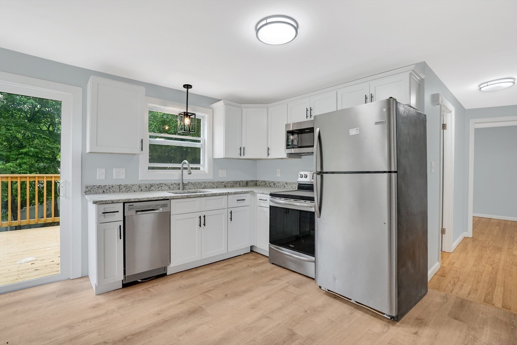738 Piper Road West Springfield, MA 01089 - Photo 8 of 24 a kitchen with a refrigerator stove and sink
