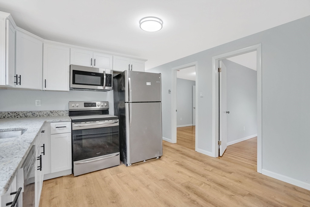 738 Piper Road West Springfield, MA 01089 - Photo 9 of 24 a kitchen with stainless steel appliances a refrigerator sink and microwave