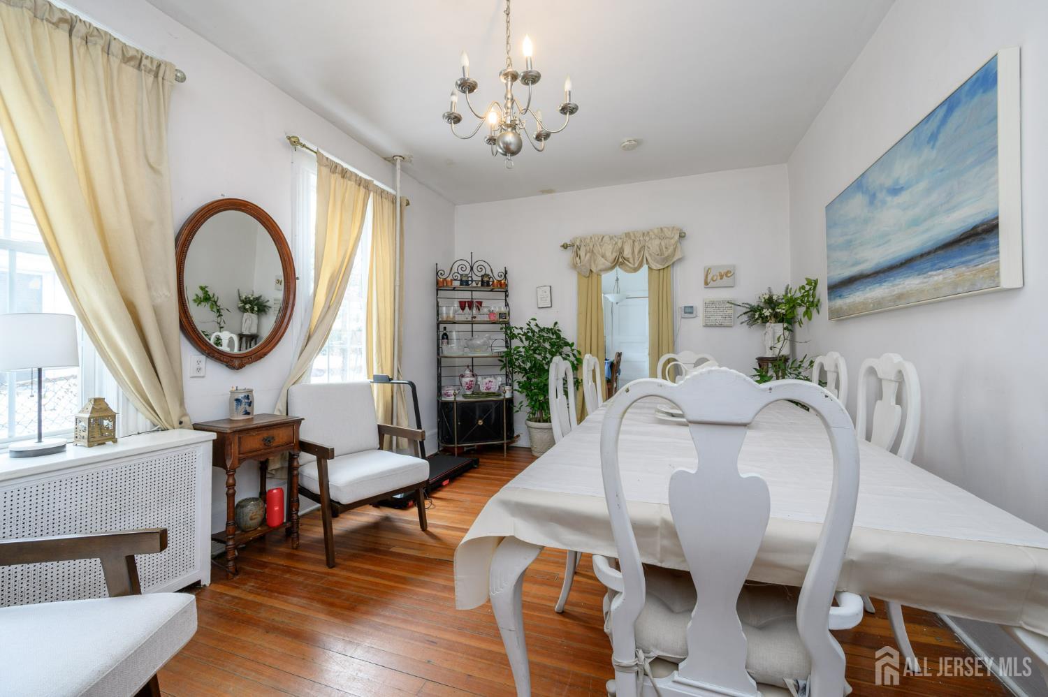 107 Market Street Perth Amboy, NJ 08861 - Photo 8 of 27 a living room with furniture a fireplace and a large window