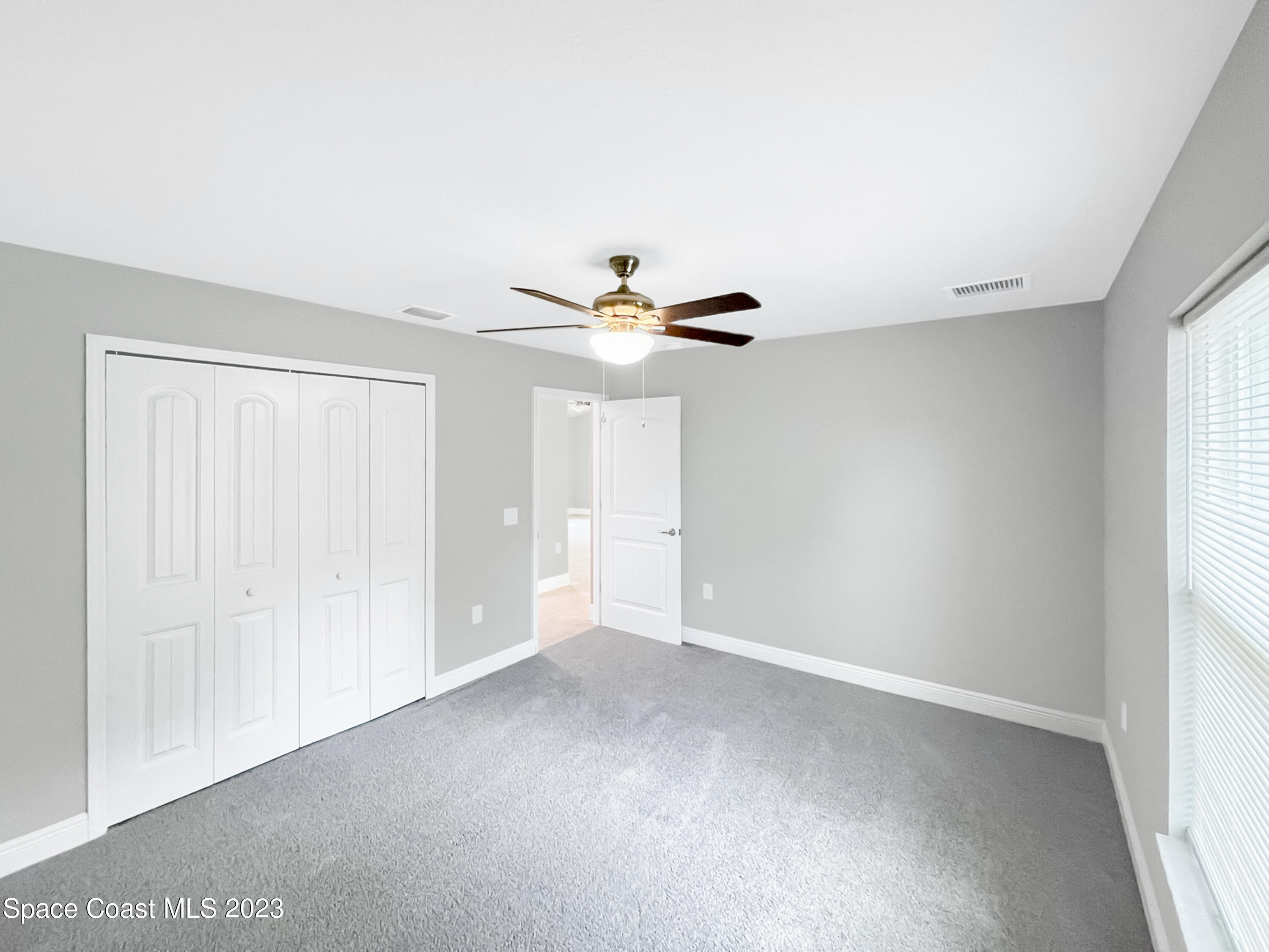2351 Angel Road Palm Bay, FL 32909 - Photo 10 of 16 a view of an empty room with a window