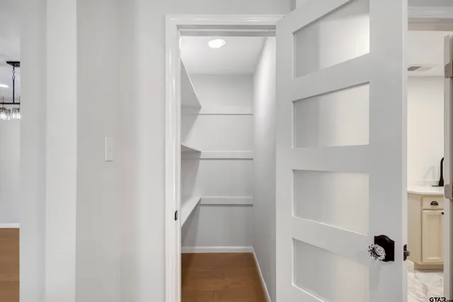 a bathroom with a glass shower door