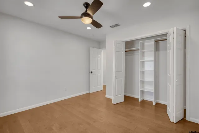 an empty room with closet area