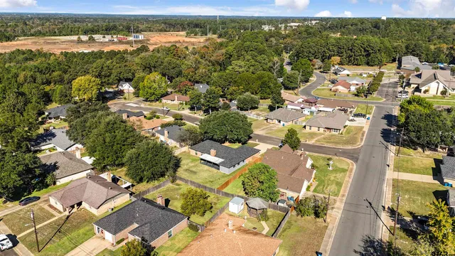 an aerial view of residential houses with outdoor space