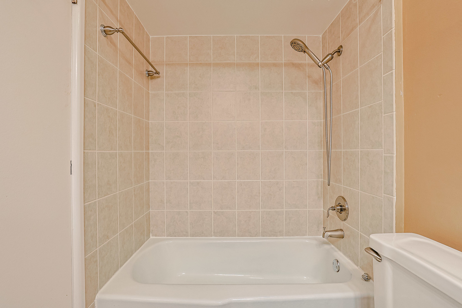 3008 Roberts Drive, Unit 5 Woodridge, IL 60517 - Photo 11 of 22 a bathroom with a shower and a toilet