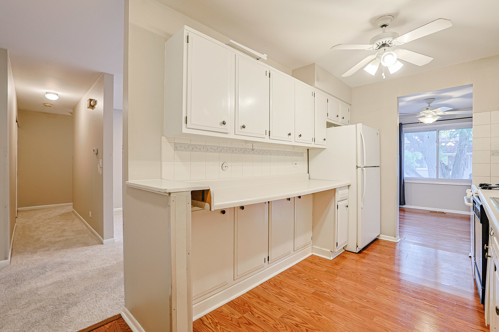 3008 Roberts Drive, Unit 5 Woodridge, IL 60517 - Photo 17 of 22 a view of kitchen with wooden floor
