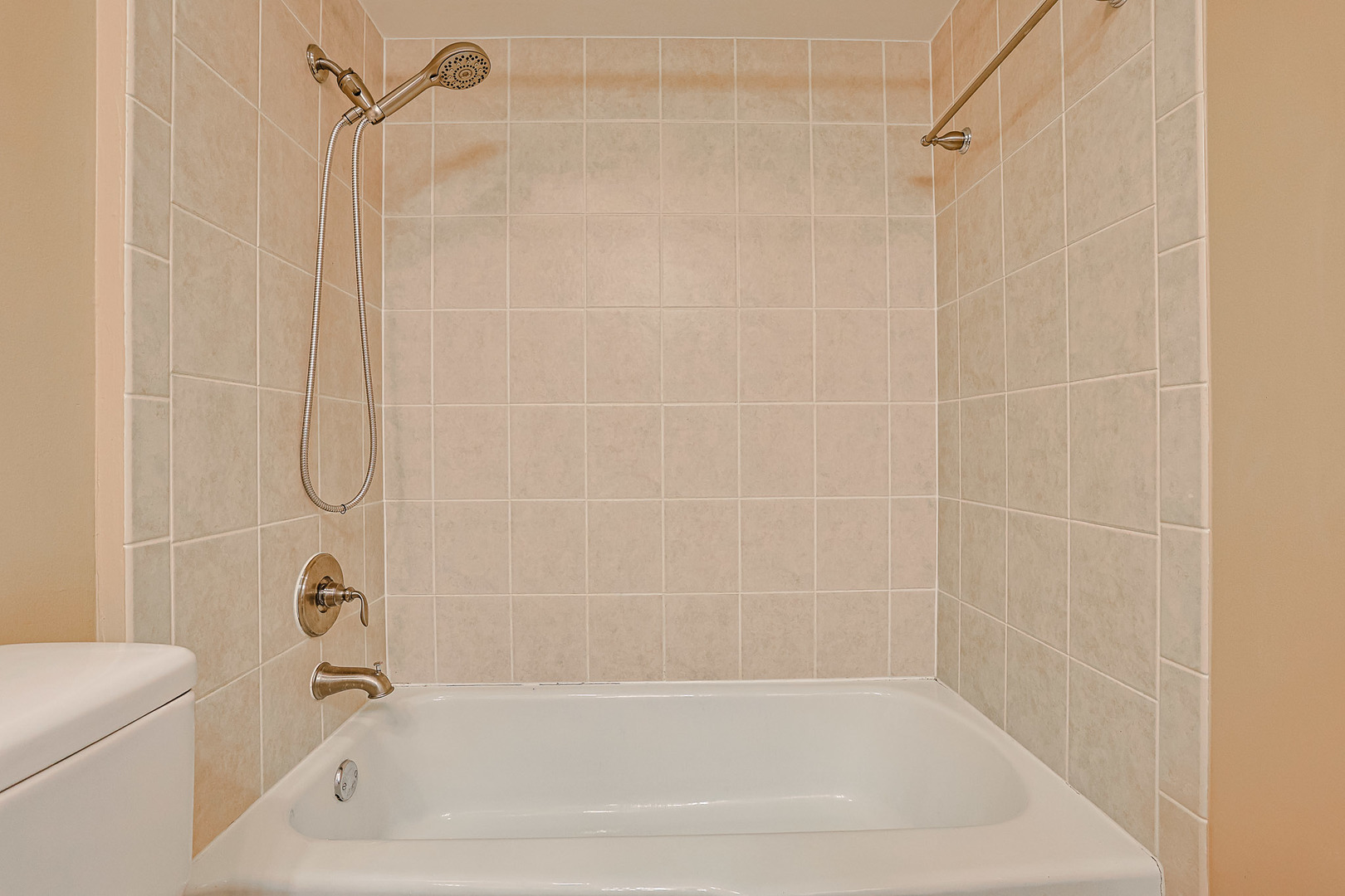 3008 Roberts Drive, Unit 5 Woodridge, IL 60517 - Photo 5 of 22 a bathroom with a shower and a bath tub