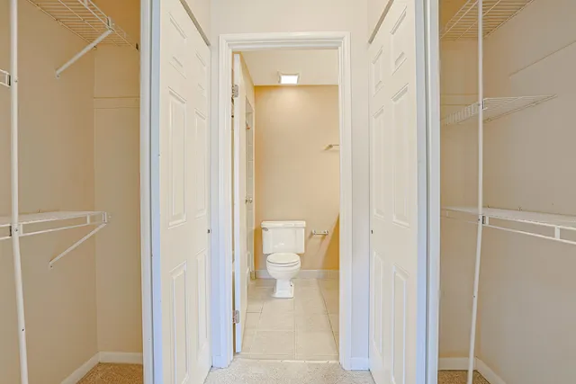 a view of a bathroom with a glass door and shower